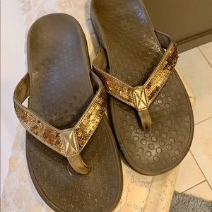 Vionic bronze flip flops, size 10